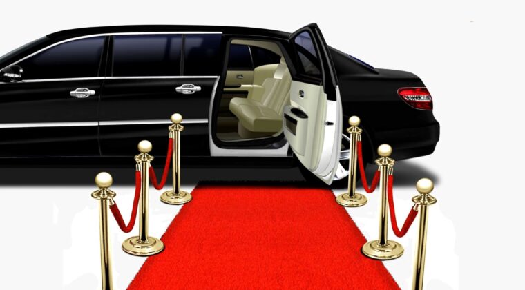 A limo is parked on the red carpet.