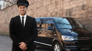 A man in a suit and tie standing next to a van.