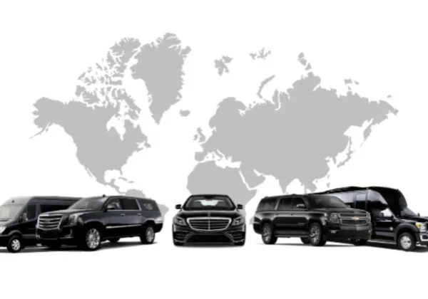 A group of cars parked in front of a map.